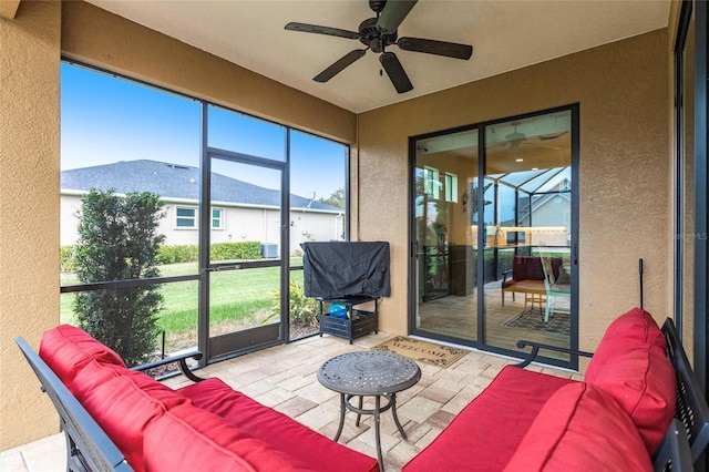 sunroom / solarium with ceiling fan