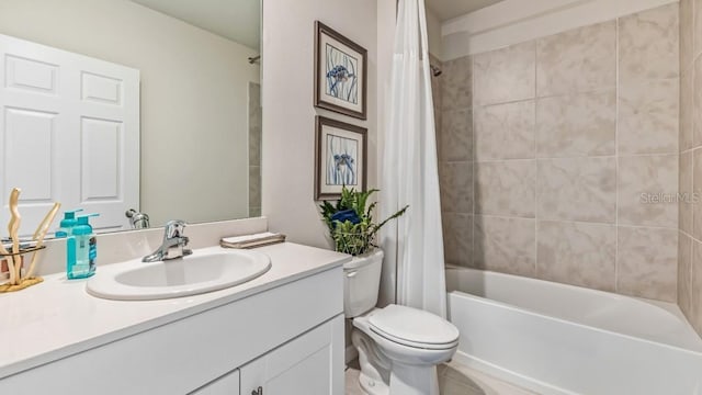 full bathroom featuring vanity, shower / tub combo, and toilet