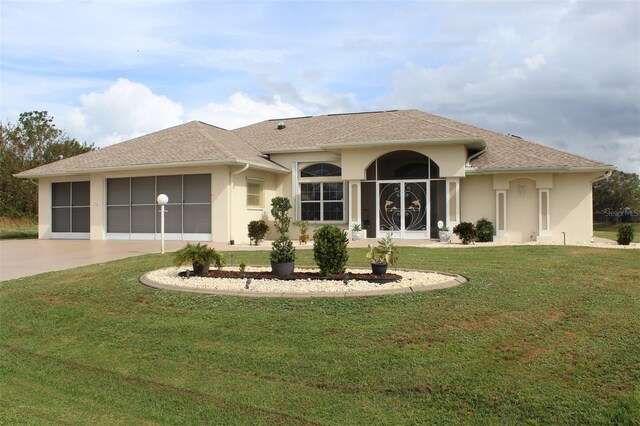 198 Coblentz St, Port Charlotte, FL 33954 - back of property with stucco siding, an attached garage, driveway, and a yard
