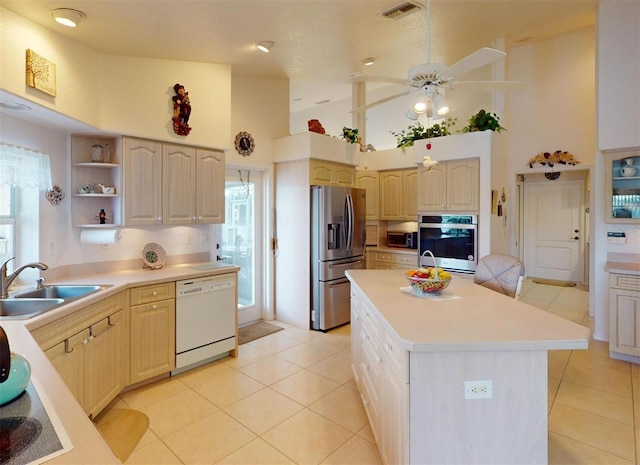 198 Coblentz St, Port Charlotte, FL 33954 - kitchen featuring appliances with stainless steel finishes, a sink, high vaulted ceiling, ceiling fan, and open shelves