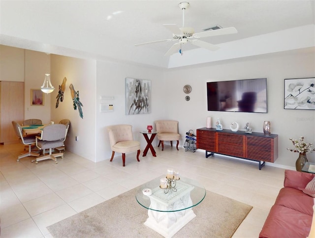 tiled living room with ceiling fan