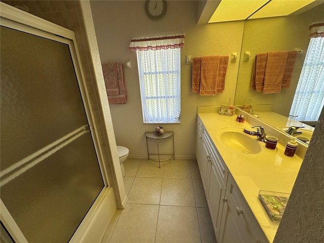 198 Coblentz St, Port Charlotte, FL 33954 - bathroom with a shower with shower door, tile patterned floors, vanity, toilet, and baseboards