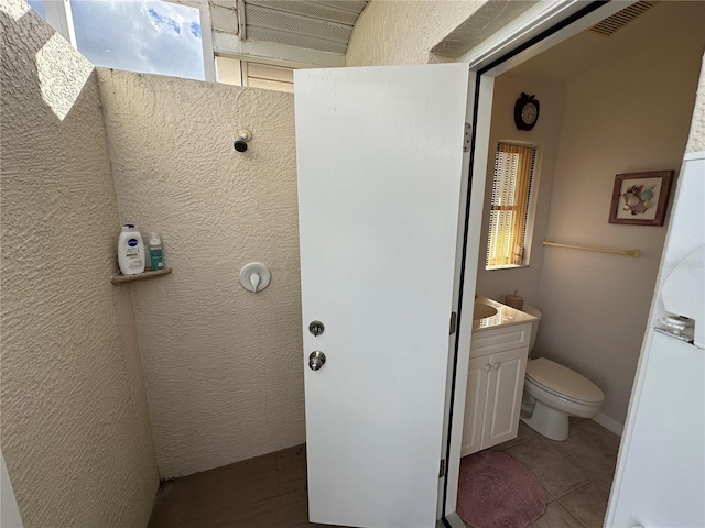 198 Coblentz St, Port Charlotte, FL 33954 - bathroom with toilet, vanity, and tile patterned floors