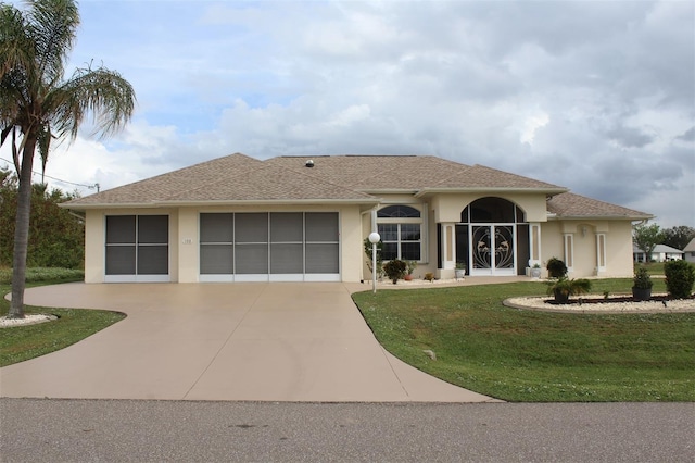 198 Coblentz St, Port Charlotte, FL 33954 - view of front of house featuring stucco siding, concrete driveway, an attached garage, and a front lawn