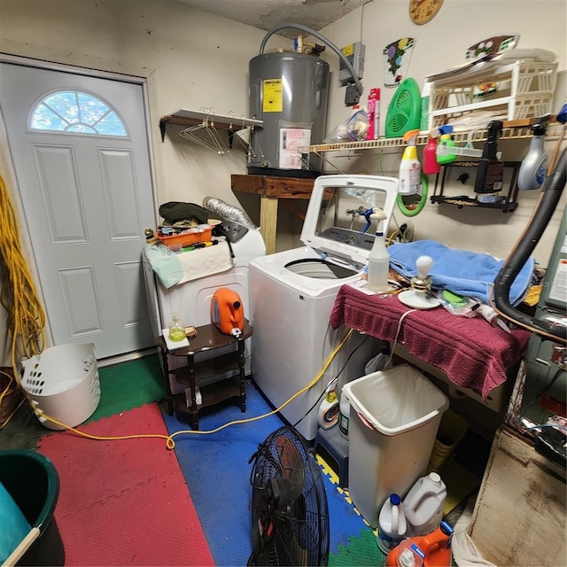 clothes washing area with electric water heater and independent washer and dryer