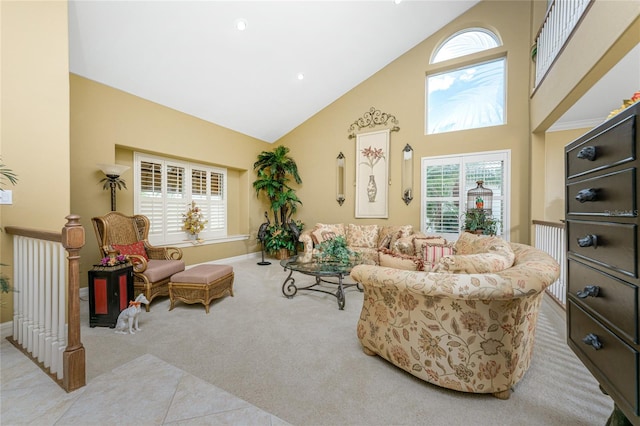 carpeted living room featuring high vaulted ceiling