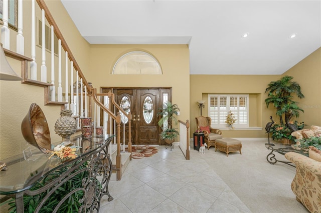 view of carpeted foyer entrance