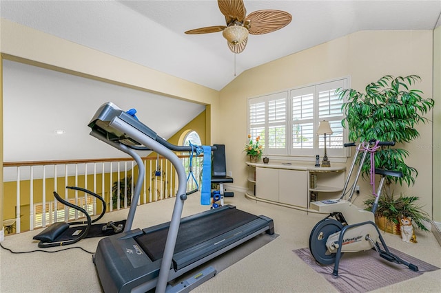 exercise room with vaulted ceiling, carpet flooring, and ceiling fan