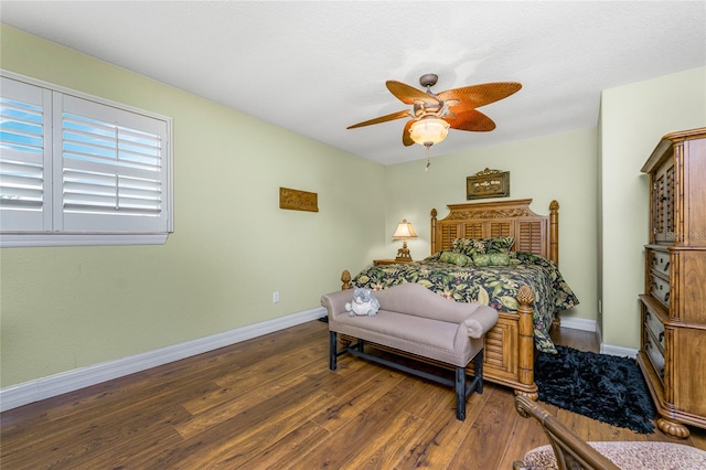 bedroom featuring dark wood-type flooring and ceiling fan