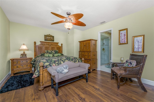 bedroom featuring dark hardwood / wood-style flooring, a textured ceiling, ceiling fan, and ensuite bathroom