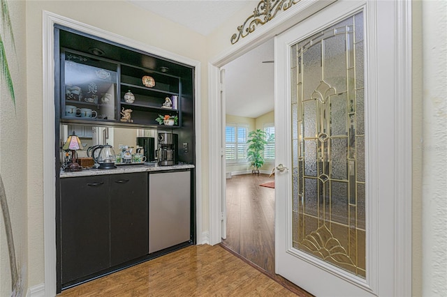 bar with hardwood / wood-style flooring