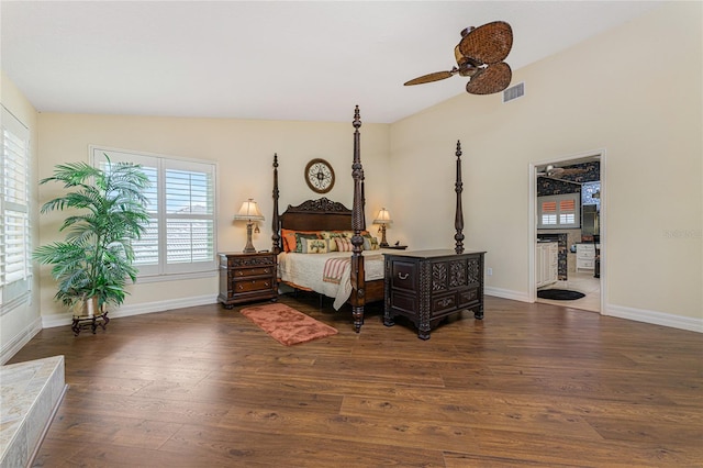 bedroom with vaulted ceiling, ceiling fan, and dark hardwood / wood-style flooring