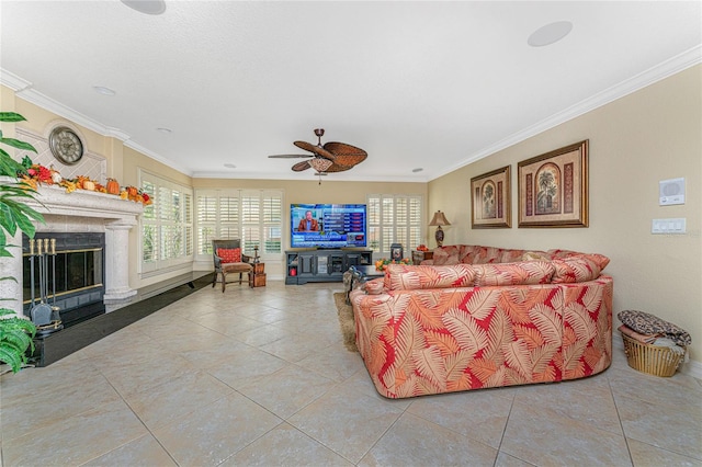 tiled living room featuring ceiling fan and ornamental molding