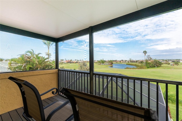 balcony featuring a water view