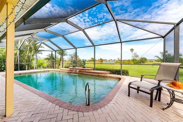 view of pool featuring glass enclosure, a yard, and a patio area