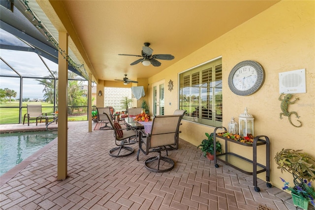 view of patio / terrace with glass enclosure and ceiling fan