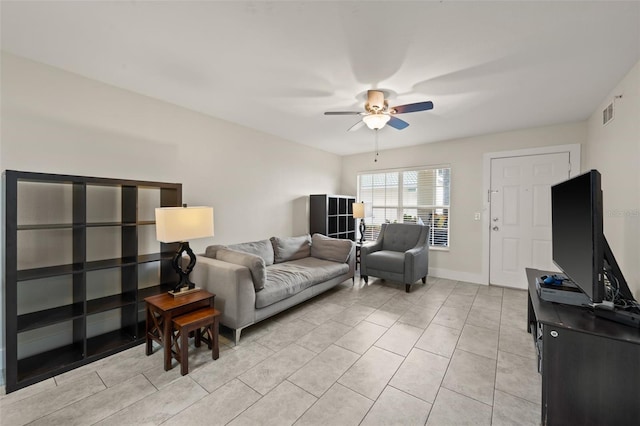 living room with ceiling fan and light tile patterned flooring