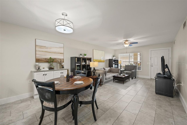 dining room featuring ceiling fan and light tile patterned floors