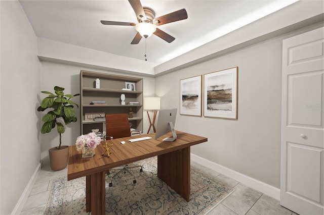 tiled office featuring ceiling fan