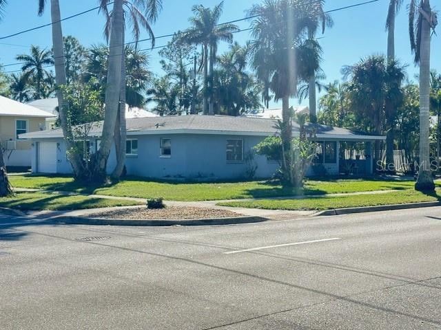 ranch-style home with a front yard