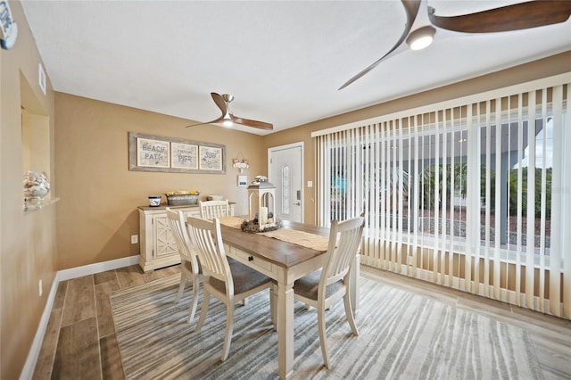 dining room featuring light hardwood / wood-style floors and ceiling fan