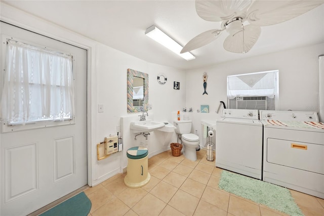 laundry area featuring washing machine and clothes dryer, ceiling fan, cooling unit, and light tile patterned floors