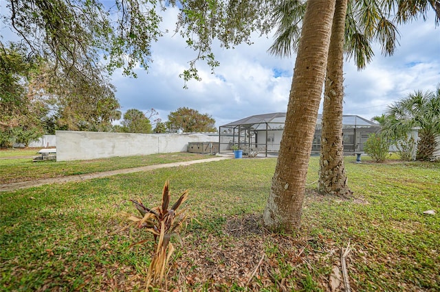 view of yard with a lanai