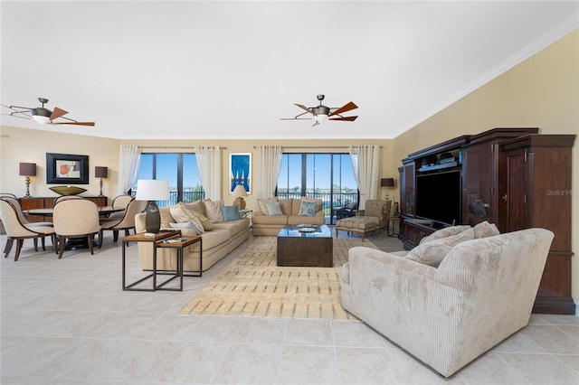 living room featuring ceiling fan, light tile patterned floors, and ornamental molding