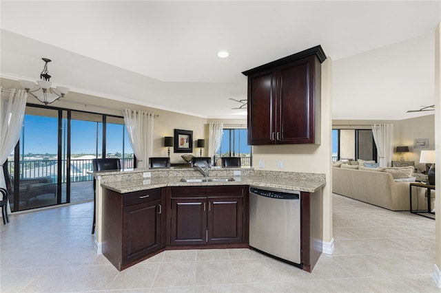 kitchen with sink, stainless steel dishwasher, ceiling fan, light stone counters, and dark brown cabinetry