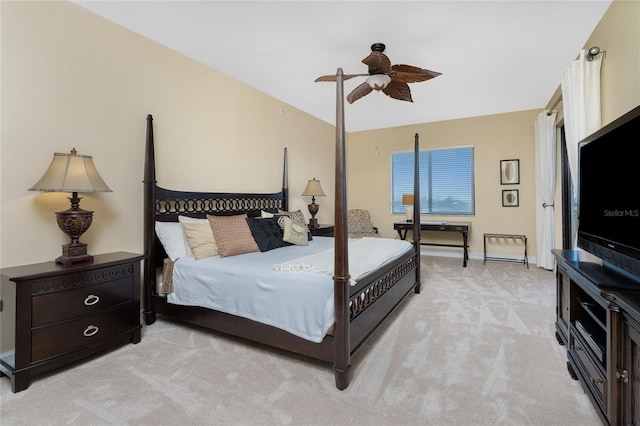 bedroom with ceiling fan and light colored carpet