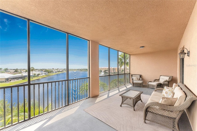 sunroom / solarium with a water view