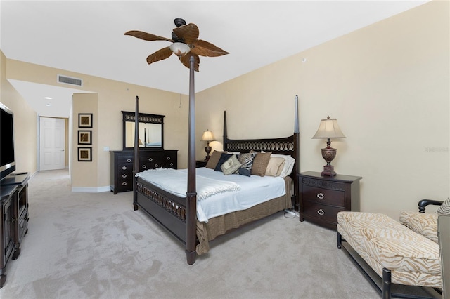 bedroom with ceiling fan and light colored carpet