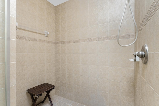 bathroom with tiled shower