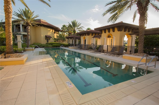 view of swimming pool with a patio area