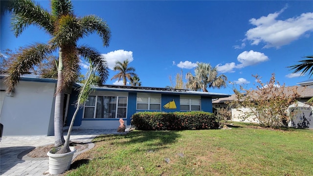 ranch-style house with a front lawn