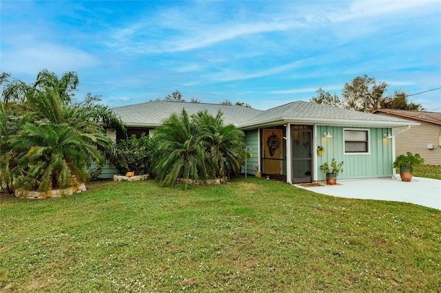 back of house featuring a yard and a patio area