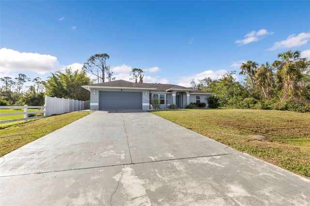 ranch-style home with a front lawn and a garage