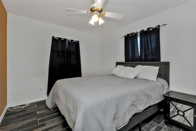 bedroom featuring ceiling fan and dark hardwood / wood-style flooring