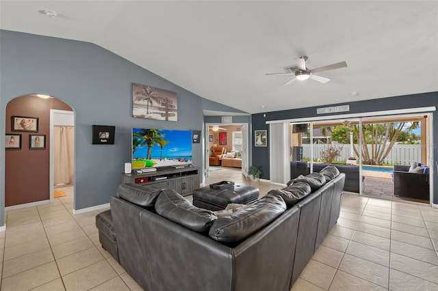 living room featuring light tile patterned floors, ceiling fan, and vaulted ceiling