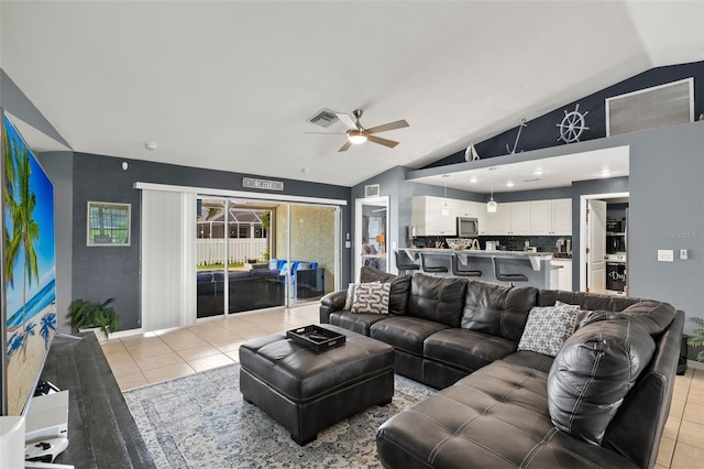 tiled living room with high vaulted ceiling and ceiling fan