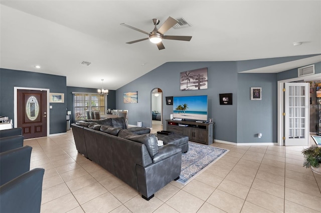 tiled living room featuring ceiling fan with notable chandelier and vaulted ceiling