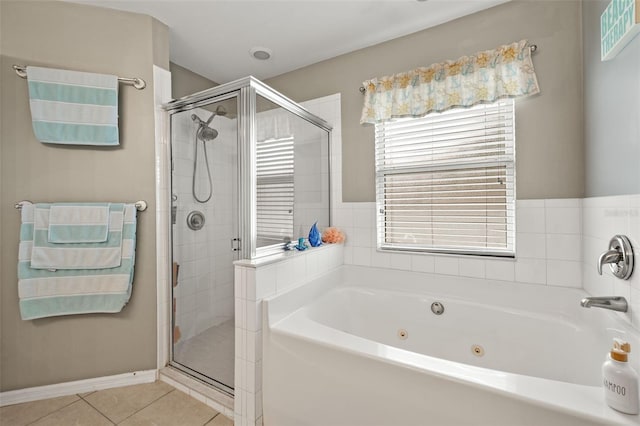 bathroom featuring tile patterned floors and separate shower and tub