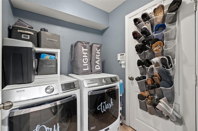 laundry room featuring independent washer and dryer and tile patterned flooring