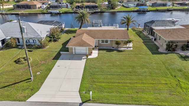 drone / aerial view with a water view