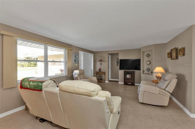 living room with light tile patterned floors