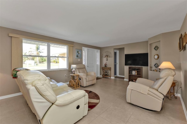 living room with light tile patterned floors