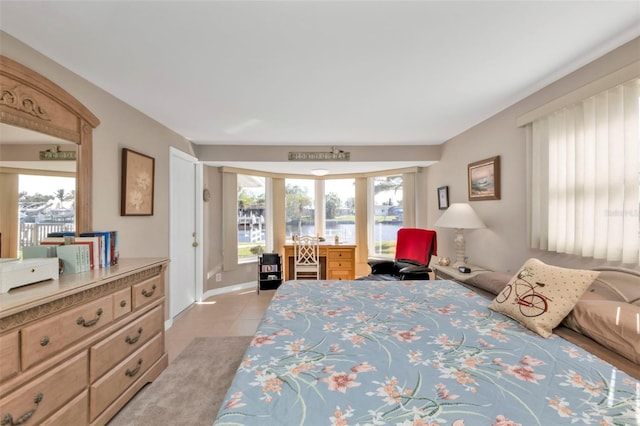 bedroom with light tile patterned floors