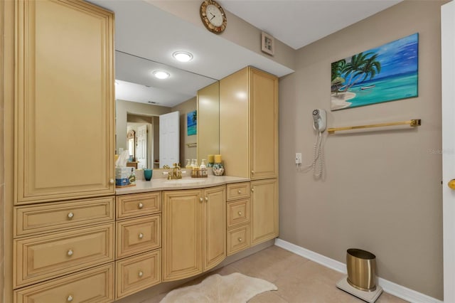 bathroom featuring tile patterned flooring and vanity