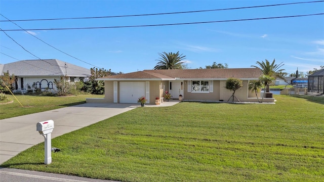 ranch-style home with a garage and a front lawn