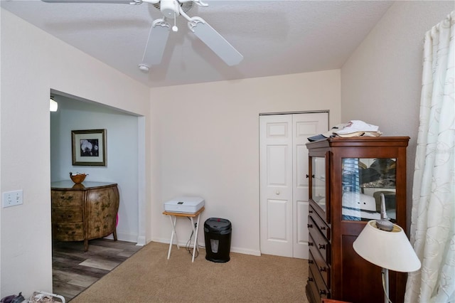 office space featuring ceiling fan, a textured ceiling, and wood-type flooring